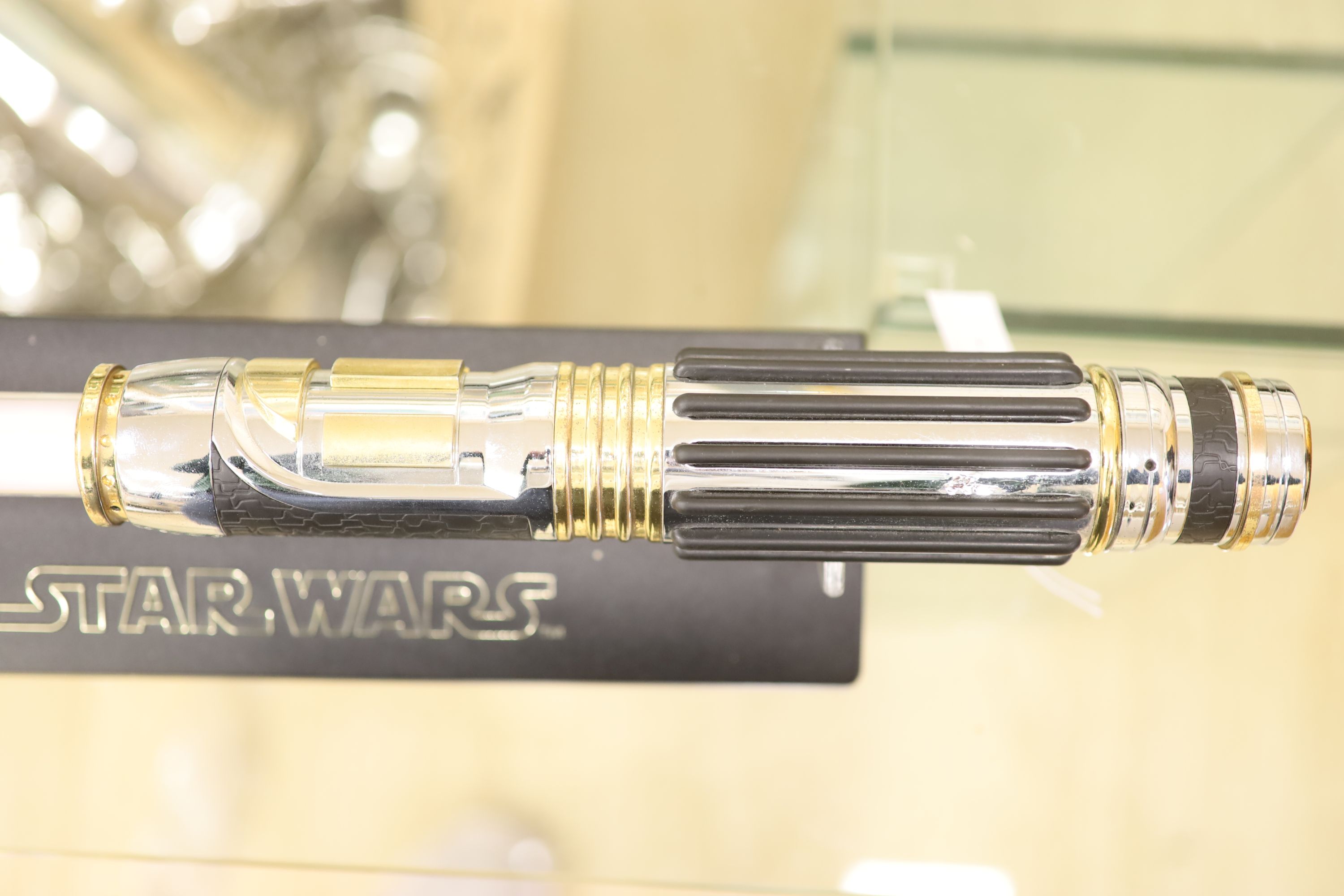 A 2005 Lucasfilm Ltd/Master replicas inc. Star Wars light saber on stand